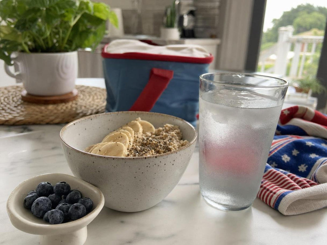 Recovery scene with water, electrolytes, and fiber-rich food after Fourth of July, illustrating gut health recovery from bloating