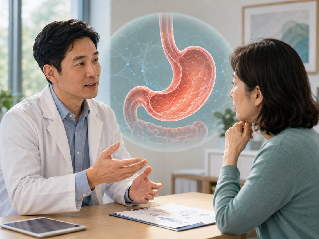 Doctor discussing gastric cancer risk and screening with a patient beside a stomach illustration